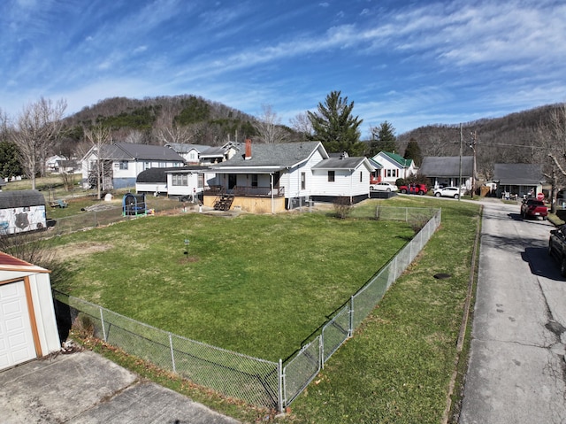 view of yard with fence private yard and a residential view