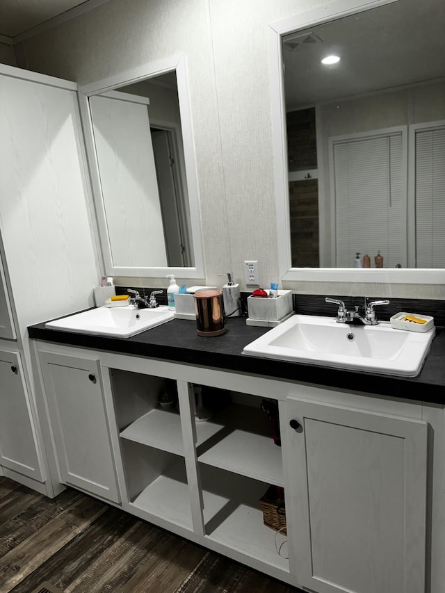 bathroom featuring hardwood / wood-style flooring and vanity