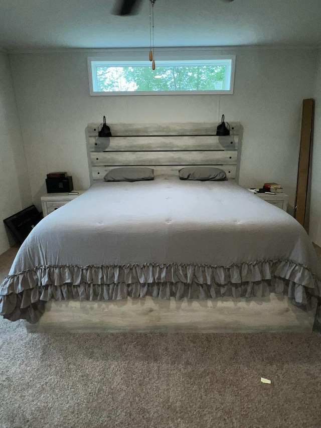 carpeted bedroom featuring multiple windows