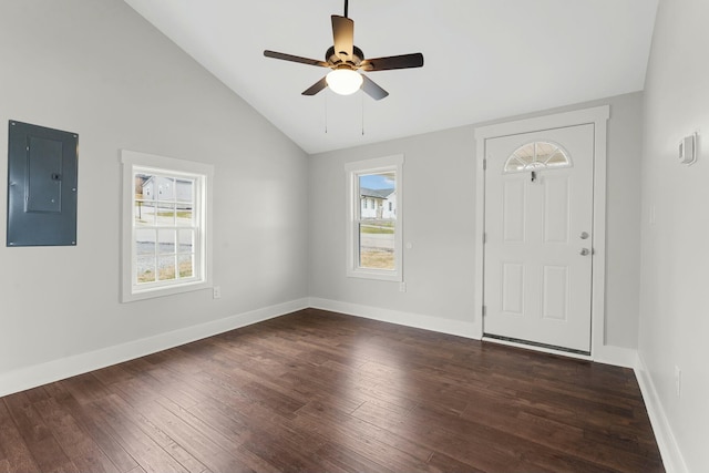 foyer entrance featuring lofted ceiling, dark wood-type flooring, a ceiling fan, electric panel, and baseboards