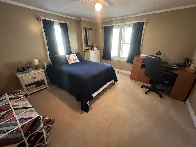 bedroom featuring multiple windows, ornamental molding, light carpet, and ceiling fan