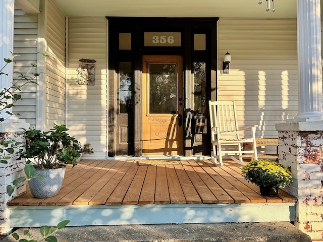 view of exterior entry featuring a porch