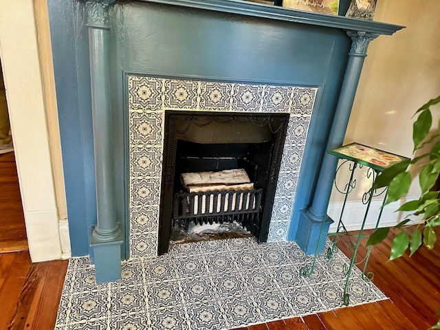 room details with a fireplace and wood finished floors