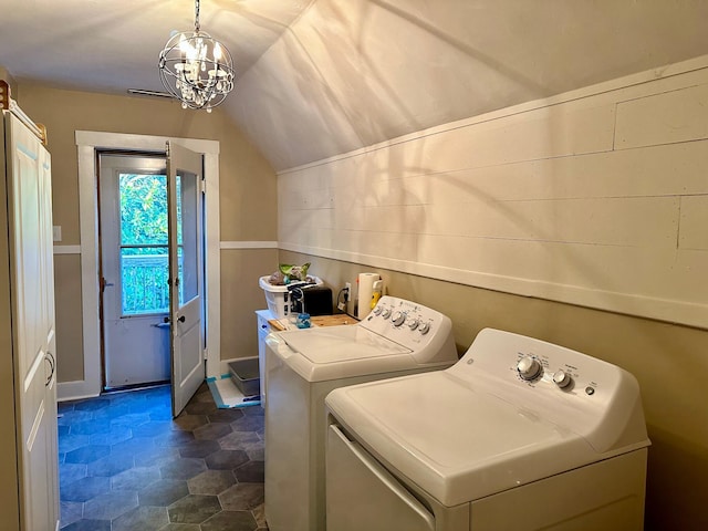 washroom with laundry area, an inviting chandelier, and washer and dryer