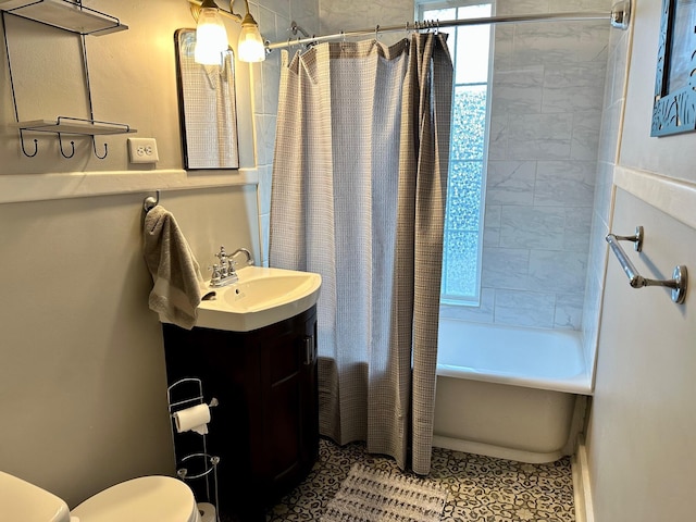 full bath featuring shower / tub combo, tile patterned flooring, vanity, and toilet