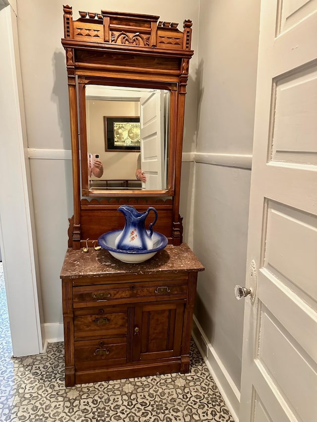 bathroom with baseboards and vanity