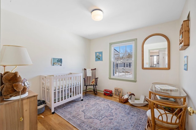 bedroom featuring light wood-style floors