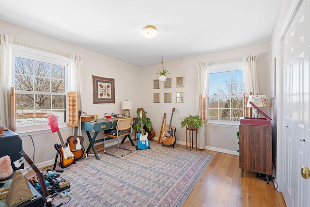 office area with light wood-type flooring and baseboards