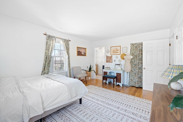 bedroom featuring wood finished floors