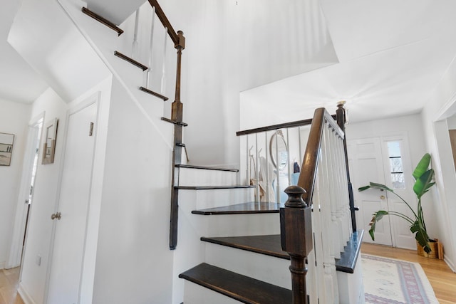 staircase with wood finished floors