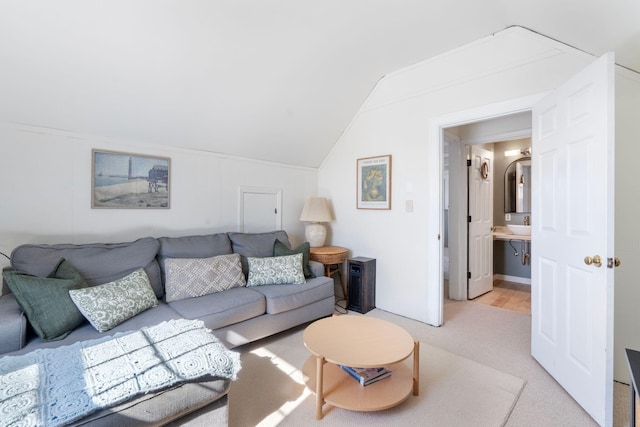 living room with light carpet and vaulted ceiling