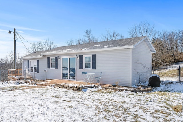 view of front of property with fence and a wooden deck