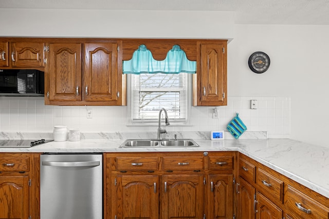 kitchen featuring sink, black appliances, and backsplash