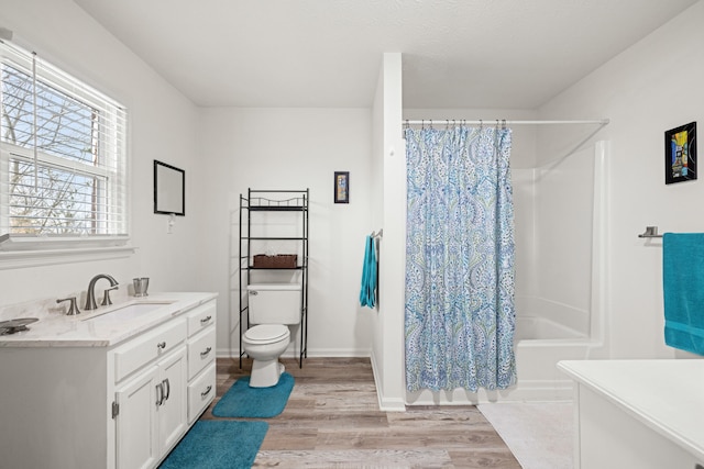 full bathroom featuring shower / bath combination with curtain, vanity, toilet, and hardwood / wood-style floors