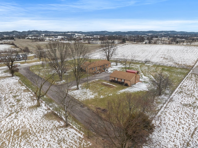 snowy aerial view with a rural view