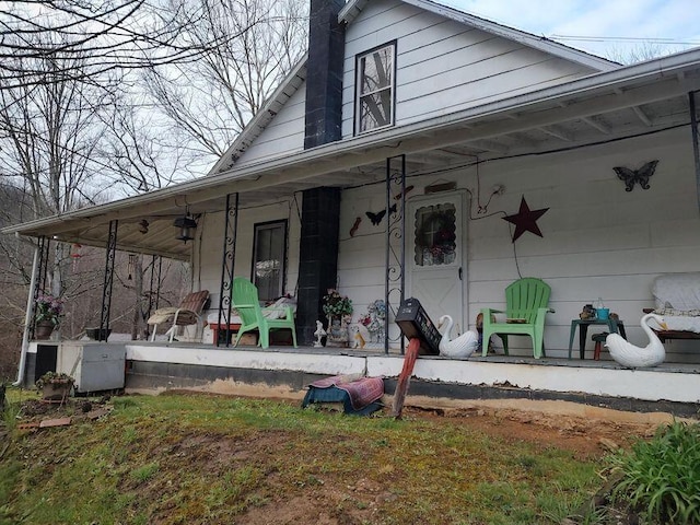 doorway to property featuring covered porch