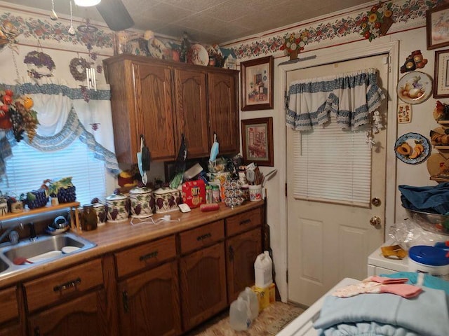 kitchen with light countertops and a sink