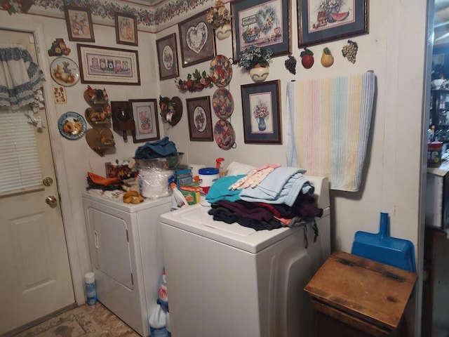 clothes washing area featuring laundry area and washer and dryer