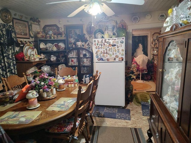 dining space with a ceiling fan