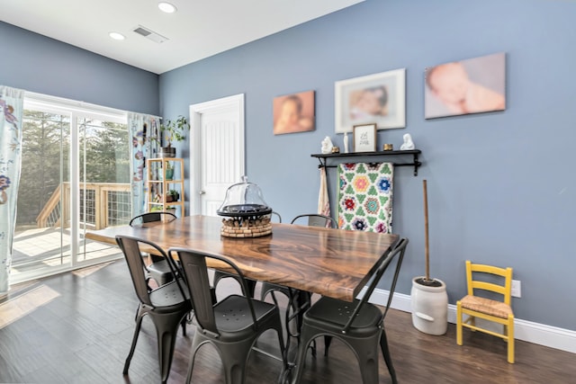 dining space featuring dark hardwood / wood-style floors