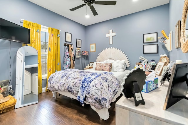 bedroom featuring dark hardwood / wood-style floors and ceiling fan