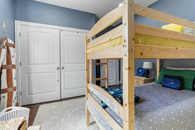 bedroom featuring dark hardwood / wood-style floors and a closet