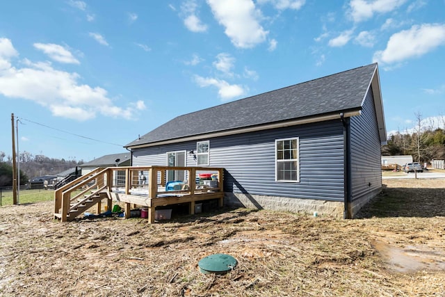 back of property featuring a deck