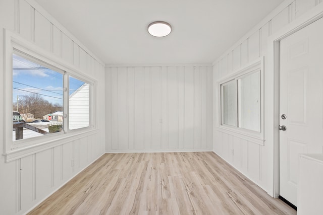 unfurnished room with light hardwood / wood-style flooring