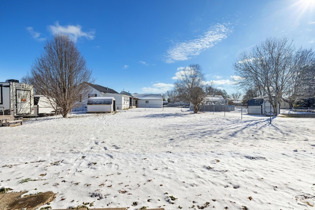 view of yard layered in snow