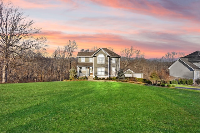 view of front of home with a yard