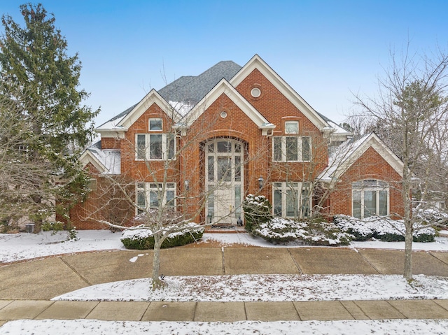 view of front of home featuring brick siding