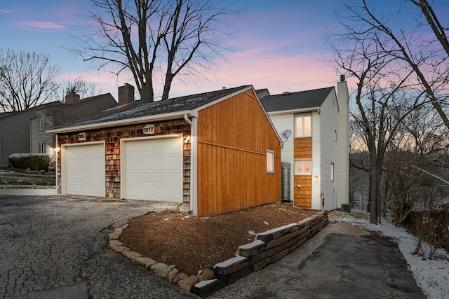 detached garage featuring central air condition unit