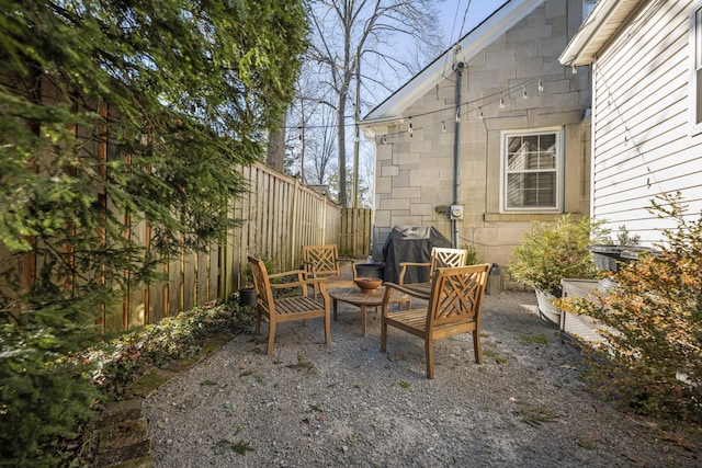 view of patio with grilling area and an outdoor living space