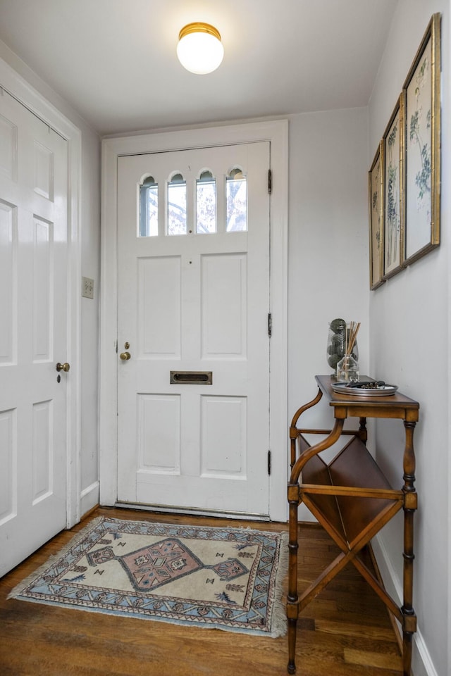 entryway with hardwood / wood-style floors