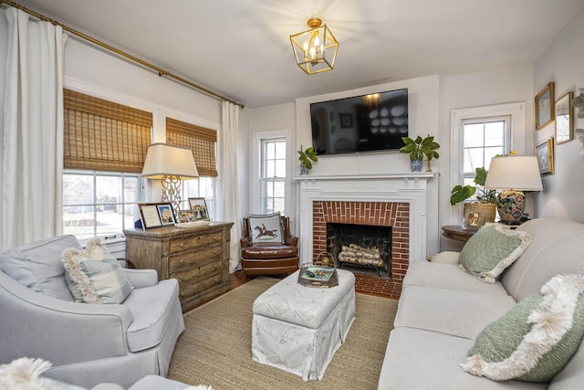 living room with a notable chandelier and a fireplace