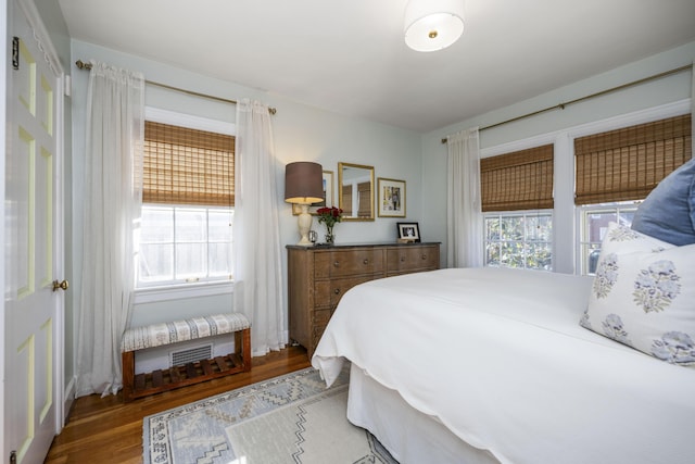 bedroom with wood-type flooring