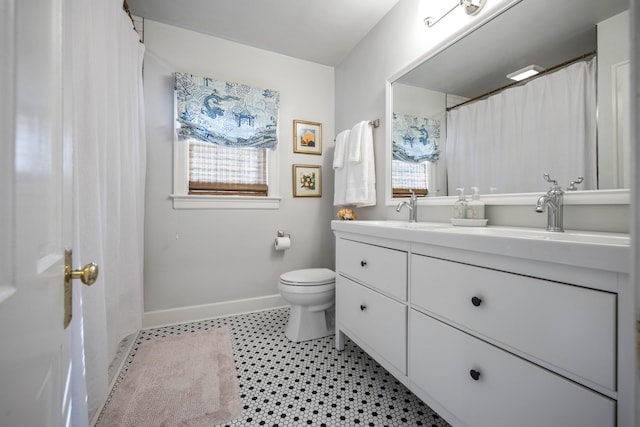 bathroom with toilet and vanity