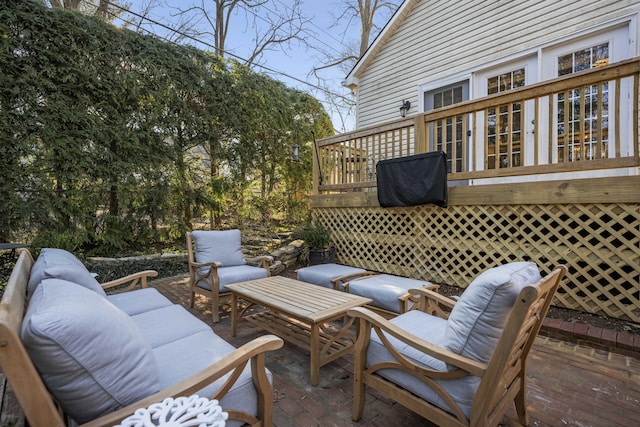 wooden deck featuring a patio and outdoor lounge area