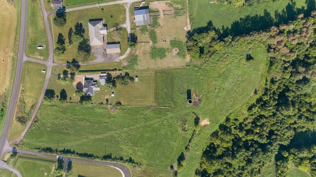 birds eye view of property with a rural view