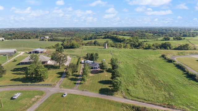 birds eye view of property with a rural view