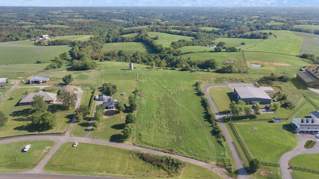 birds eye view of property with a rural view