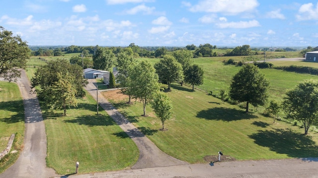 birds eye view of property with a rural view