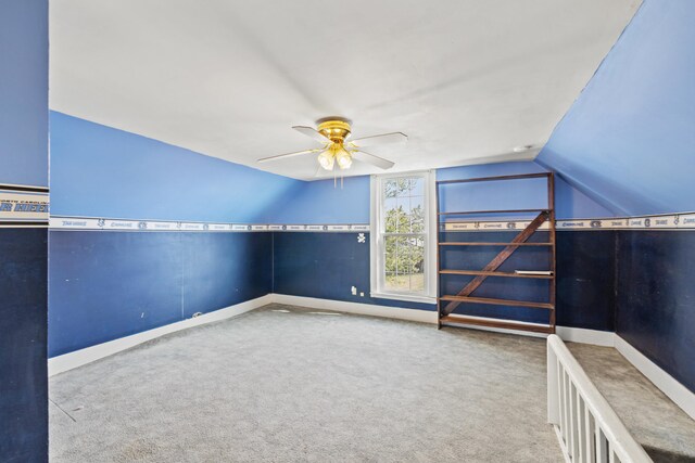 bonus room with carpet floors, baseboards, a ceiling fan, and lofted ceiling