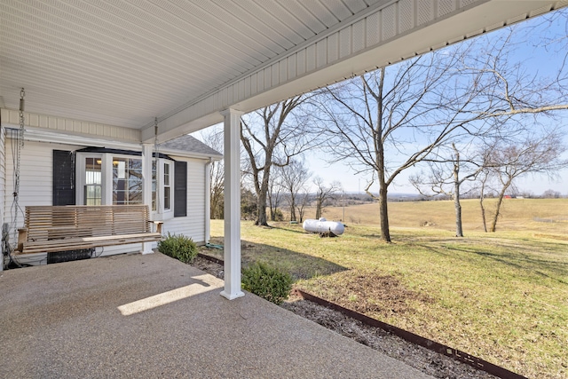 view of patio / terrace with a rural view