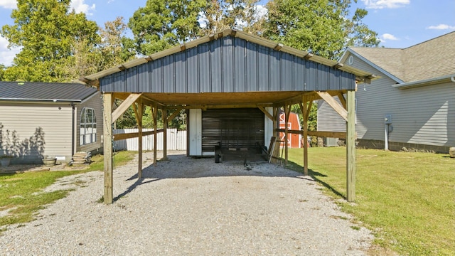 view of vehicle parking featuring gravel driveway and fence