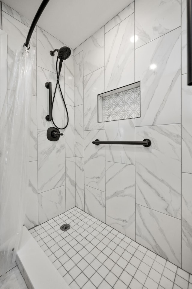 bathroom with a shower stall