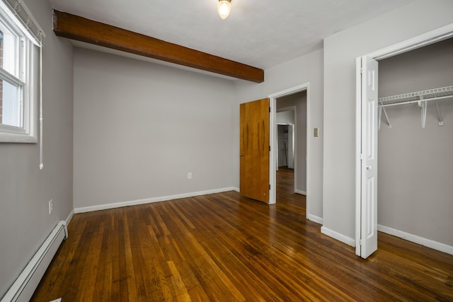 unfurnished bedroom with baseboards, dark wood-style floors, a baseboard radiator, beam ceiling, and a closet