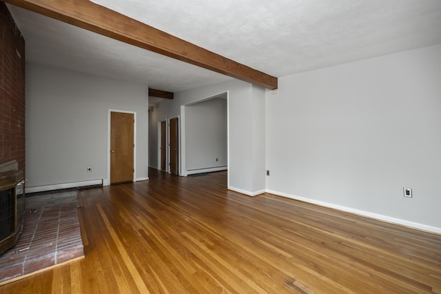 unfurnished living room with a baseboard radiator, beam ceiling, baseboards, and wood finished floors