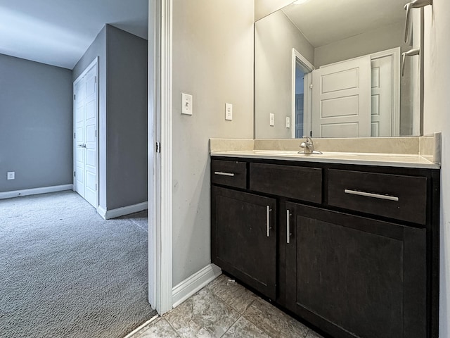 bathroom featuring vanity and baseboards