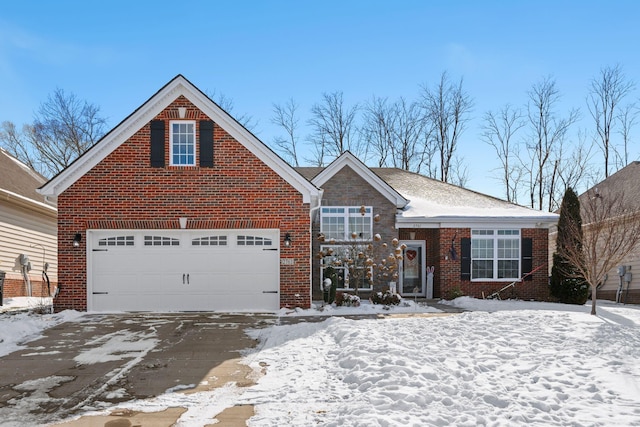 traditional-style home featuring a garage and brick siding